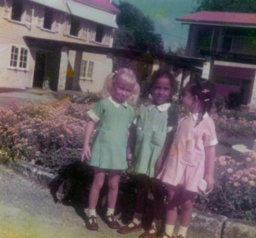 Maria Mohammed-Maharaj, the child in the centre, aged four with two schoolmates in Barbados